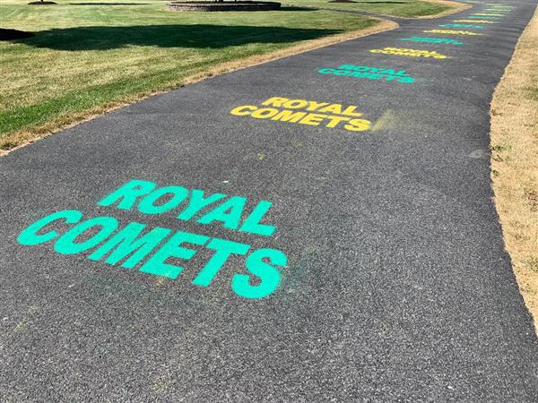 Royal Comets painted on the walkway to the Elmer Gordon Stadium